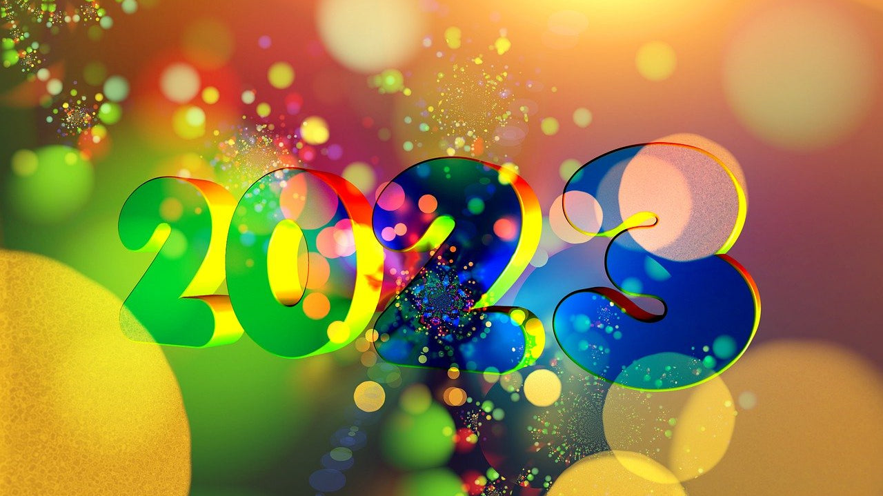 Vibrant 2023 New Year design with colorful lights and festive celebration background.