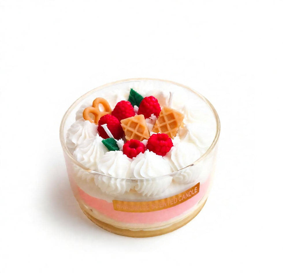 Jellycup cake soy wax candle with whipped topping, raspberries, waffle squares, and a pretzel.