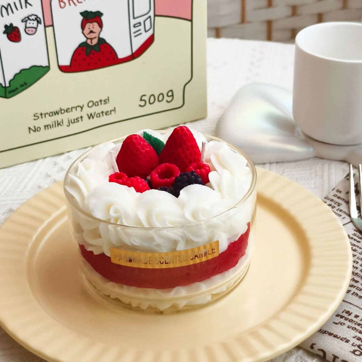 Jellycup cake soy wax candle topped with whipped wax and berries, with a "Handmade Scented Candle" label.