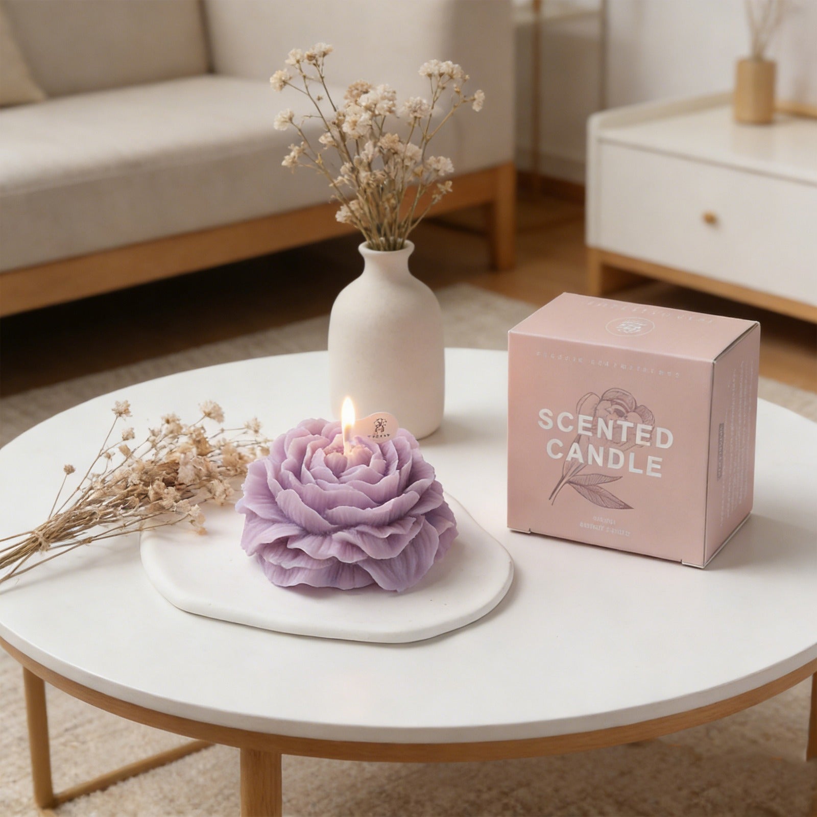 Lavender peony flower soy wax candle by Jellycup, sitting on a white ceramic tray next to a product box.