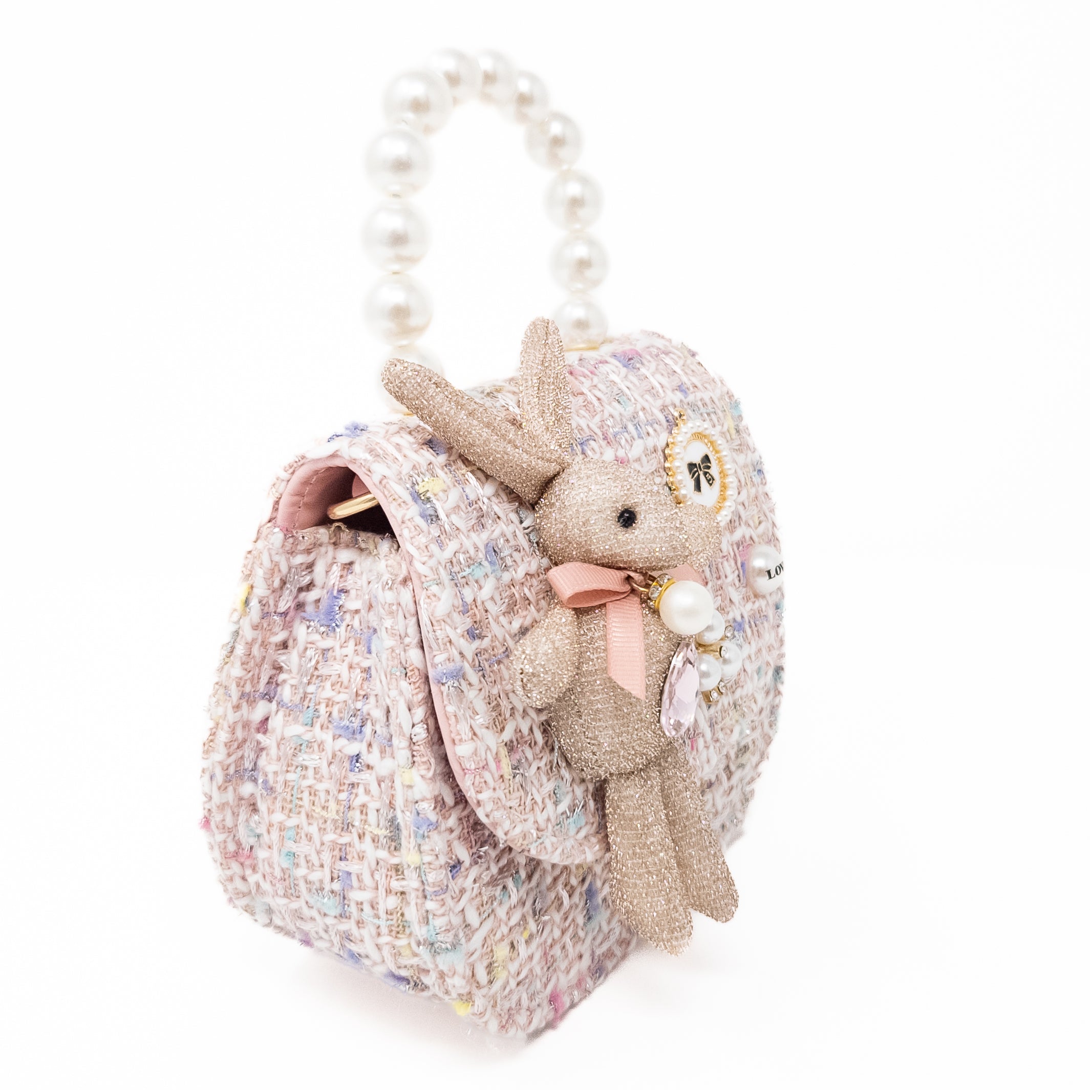 Pink tweed purse with pearl handle and bunny charm.