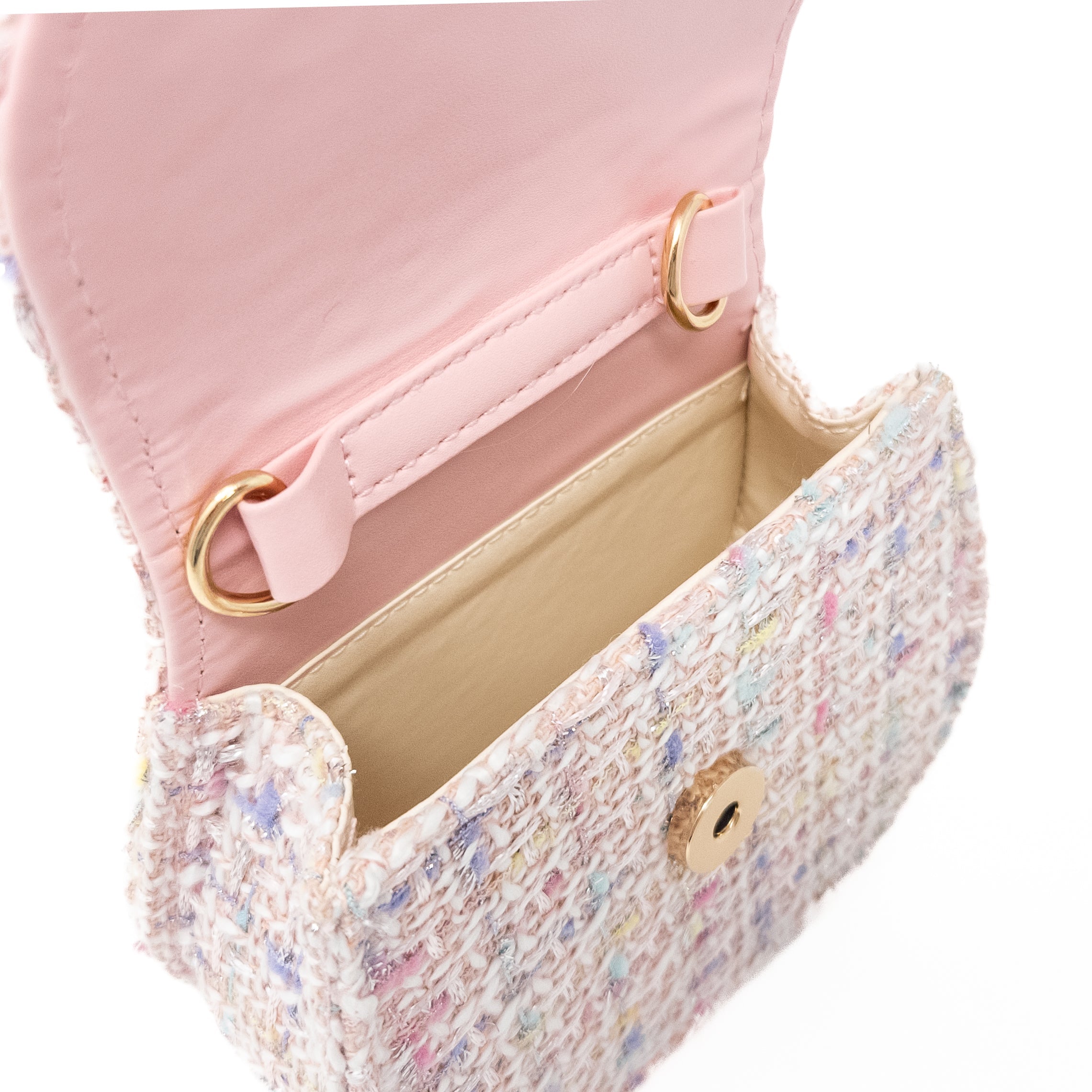 Open light pink tweed purse with gold accents.