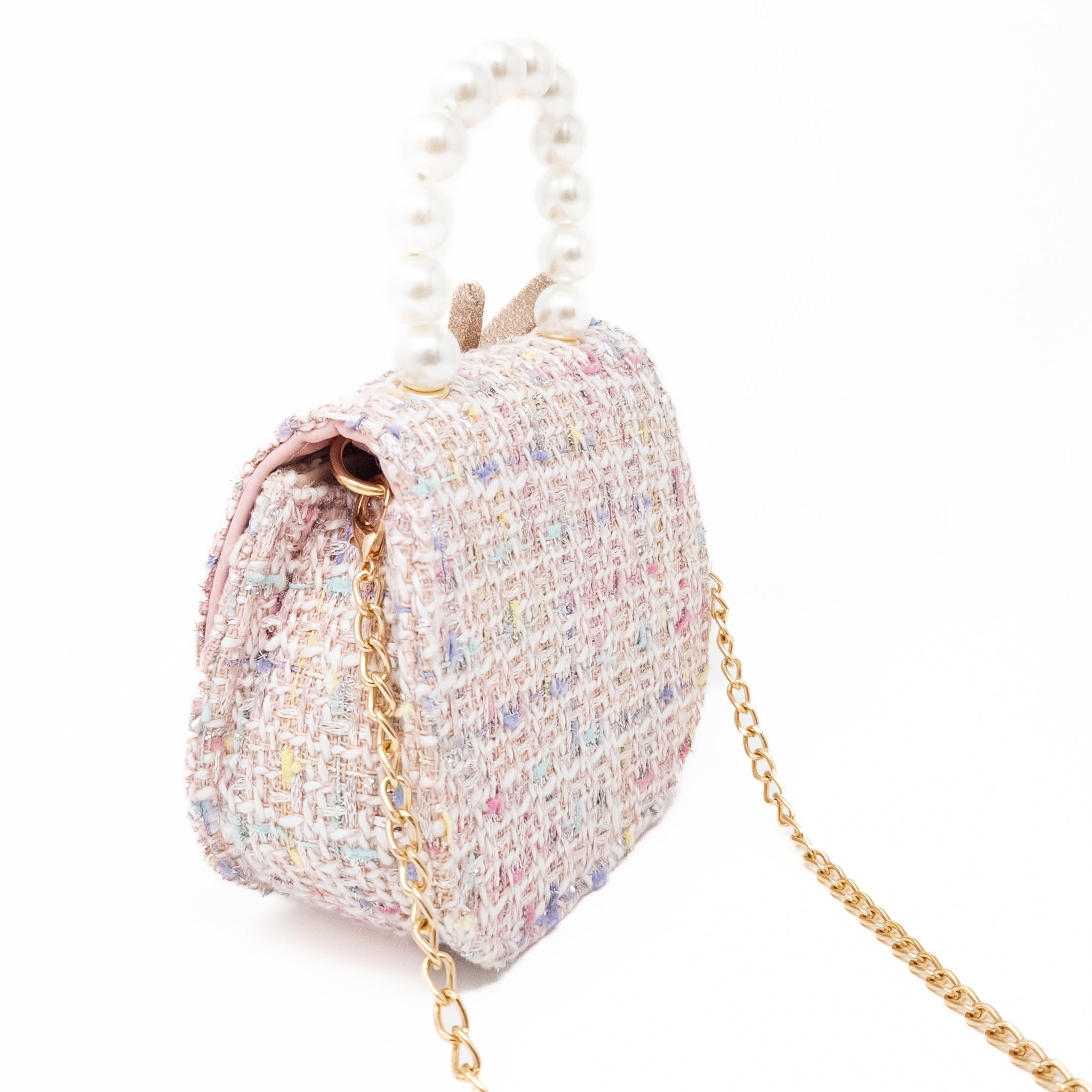 Pink tweed purse with pearl handle and gold chain strap.