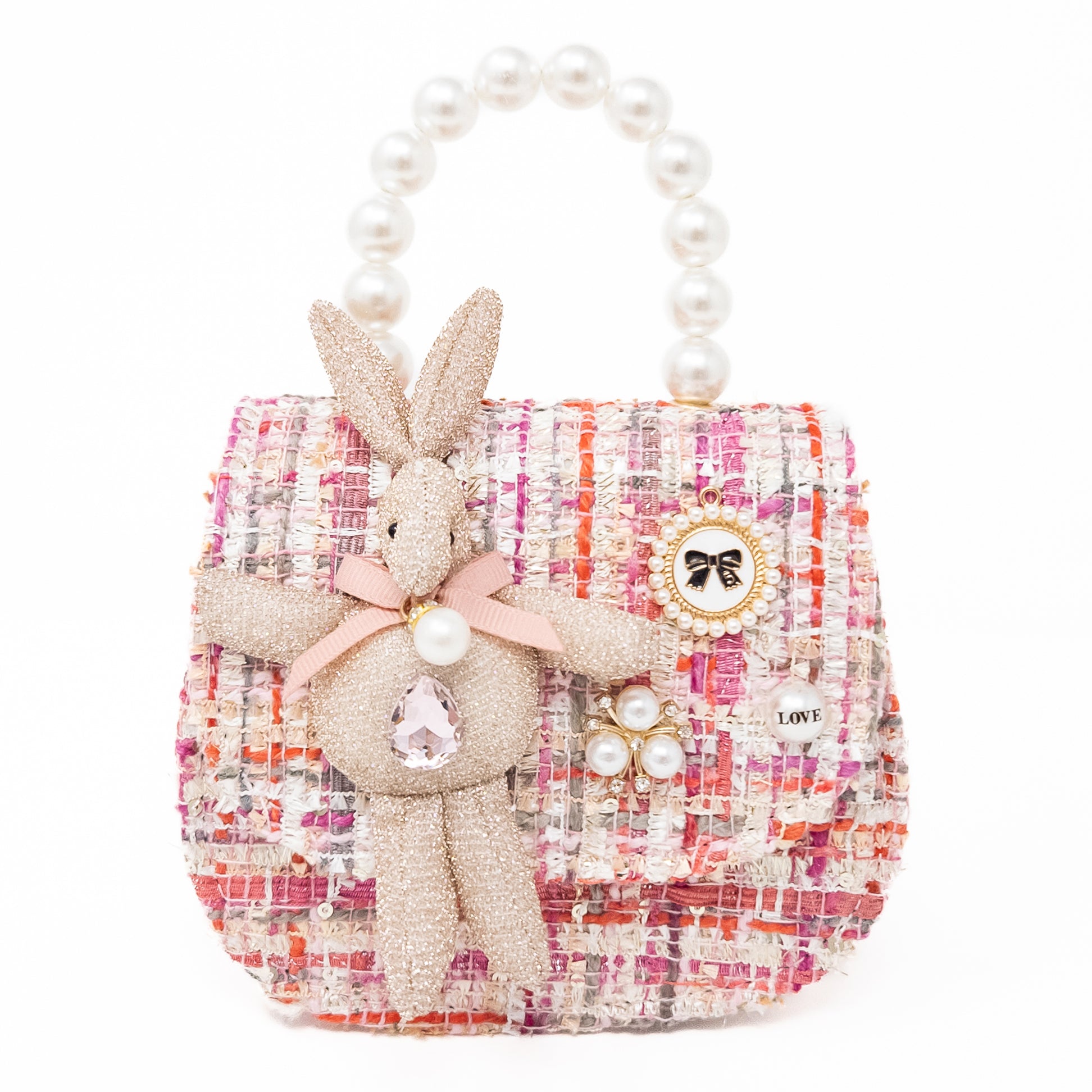 A pink and white tweed handbag with pearl handle and rabbit embellishment.