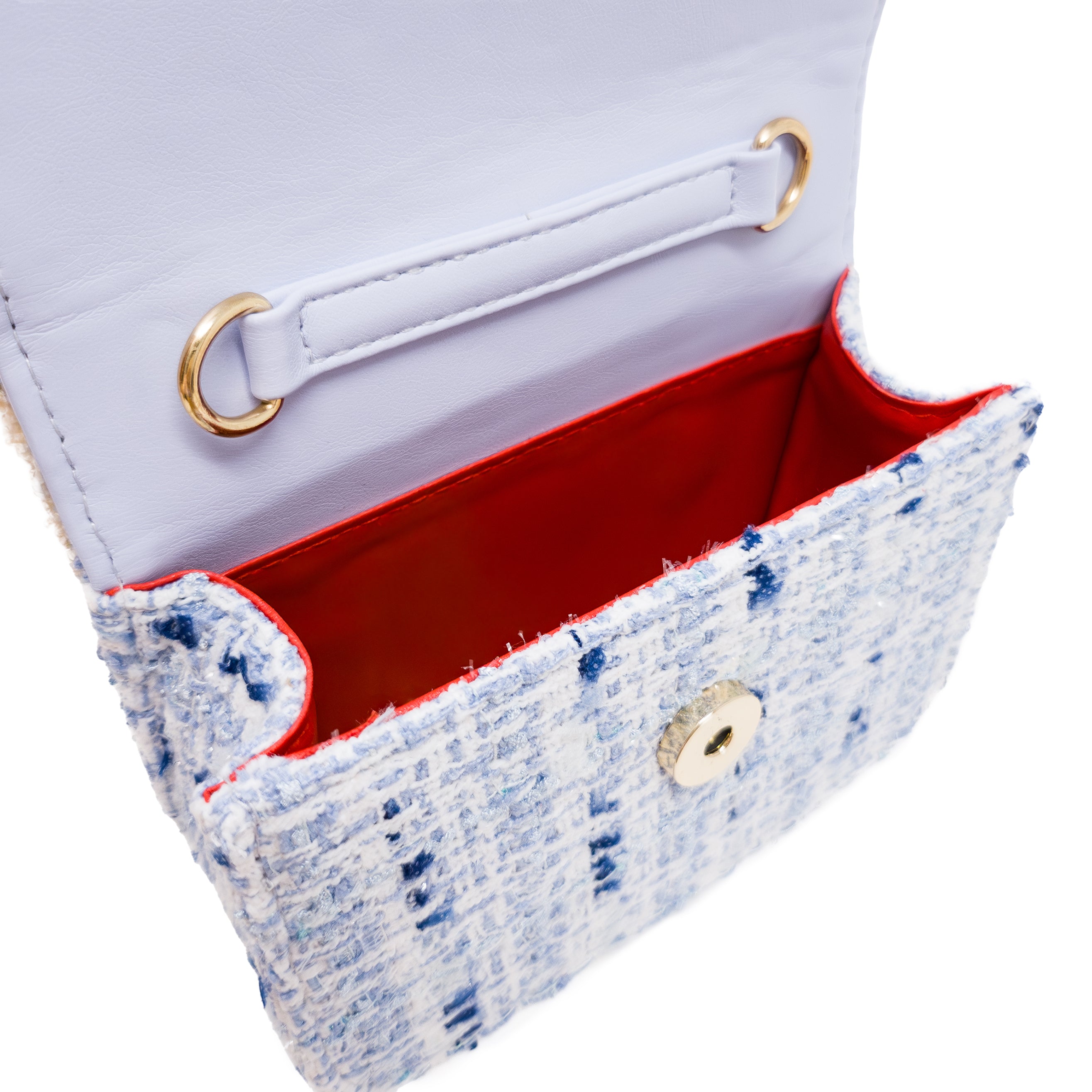 Puttisu Pearl Garden Blue Hydrangea. Close-up of a blue textured handbag with red interior and gold accents on a white background