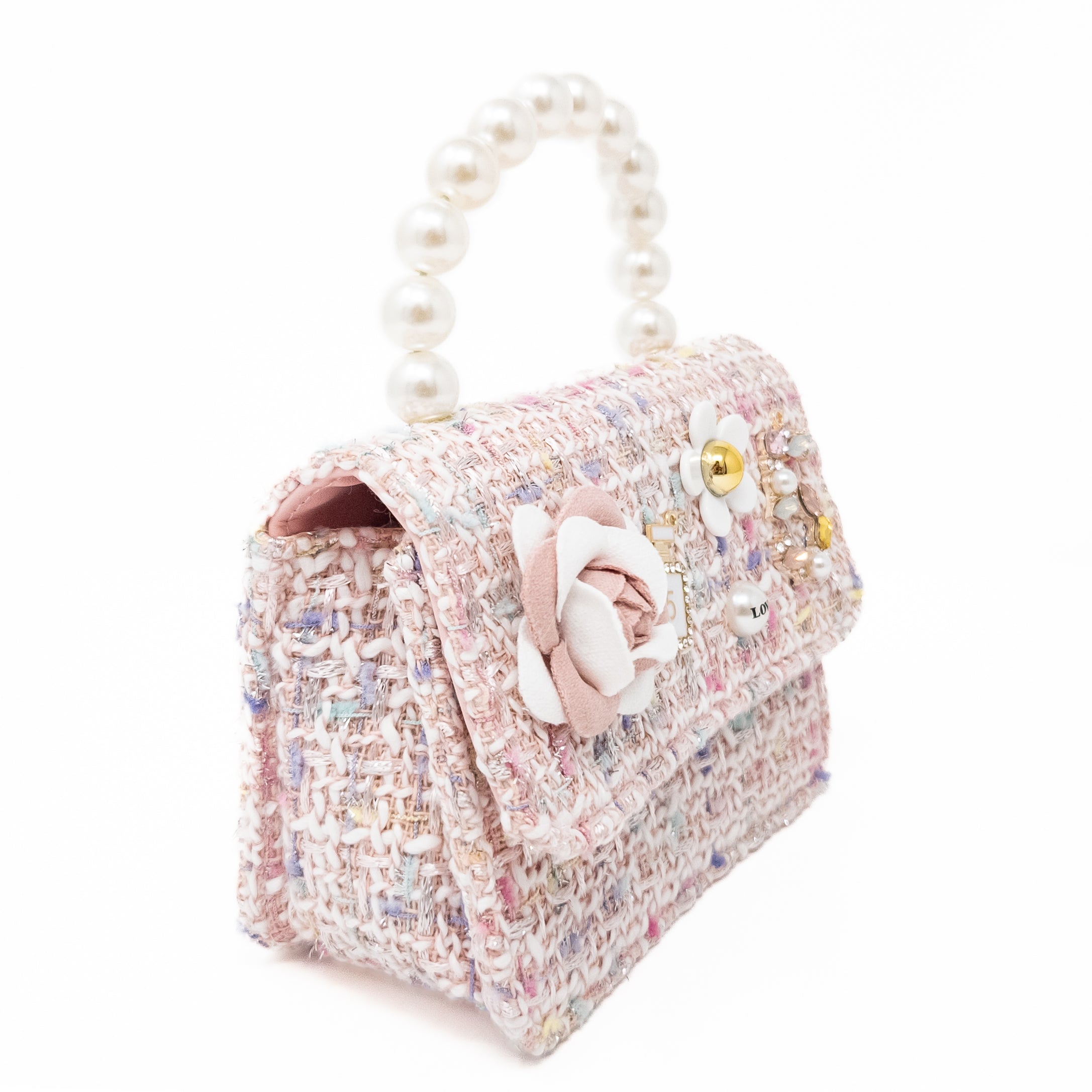 Pink tweed purse with pearl handle and floral embellishments.