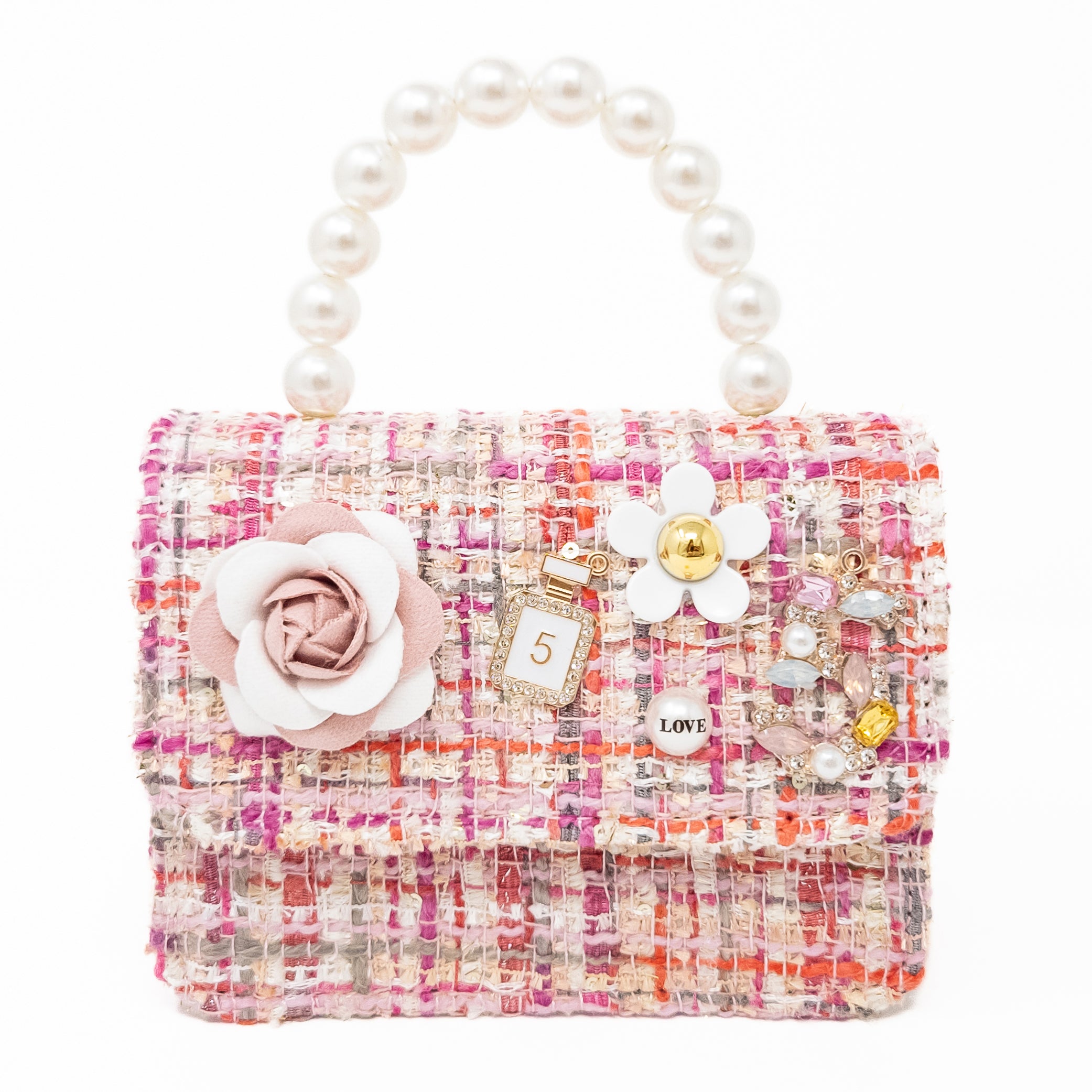 Pink tweed handbag with pearl handle and flower and gem embellishments.