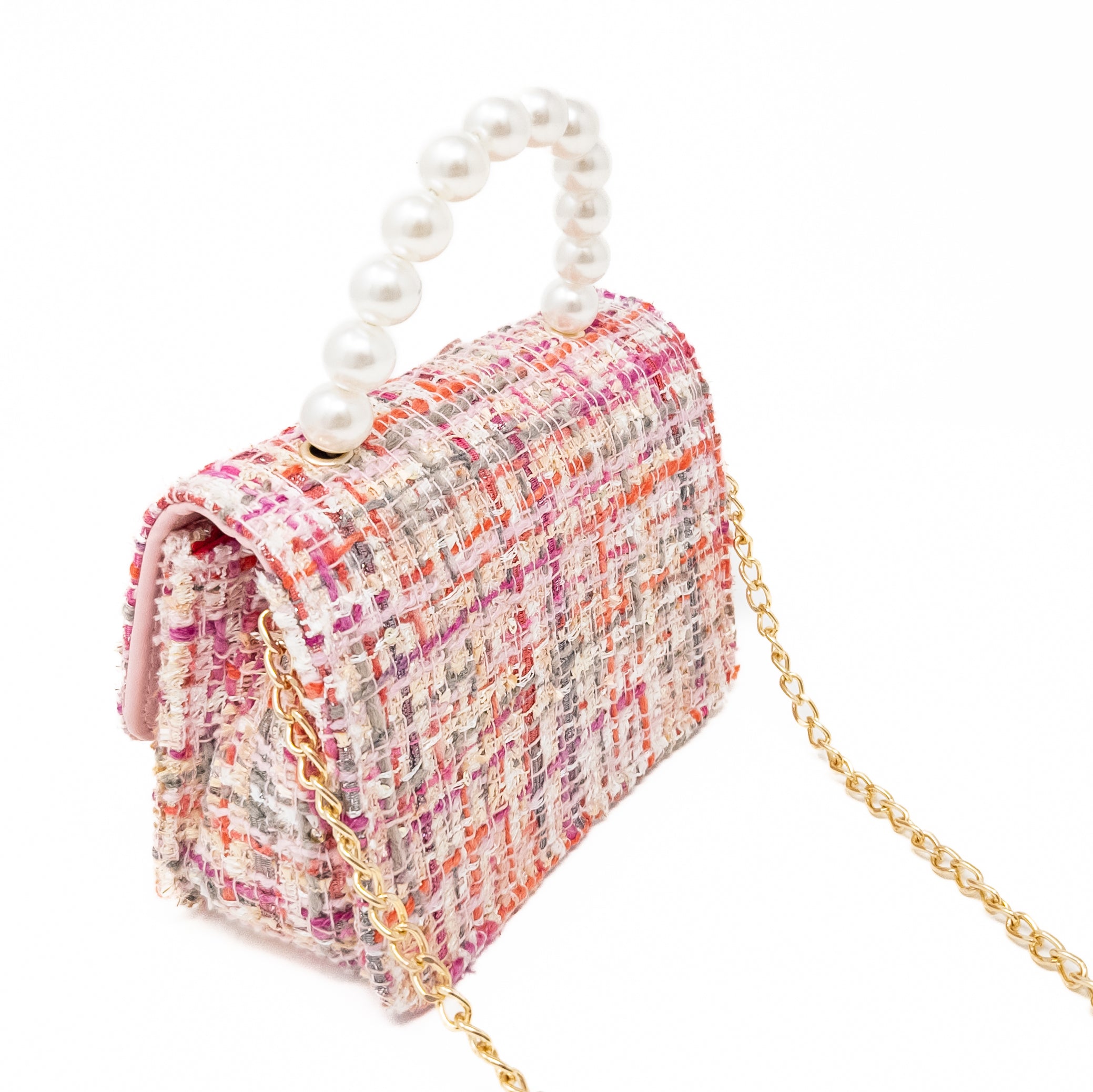 Pink tweed purse with pearl handle and gold chain.