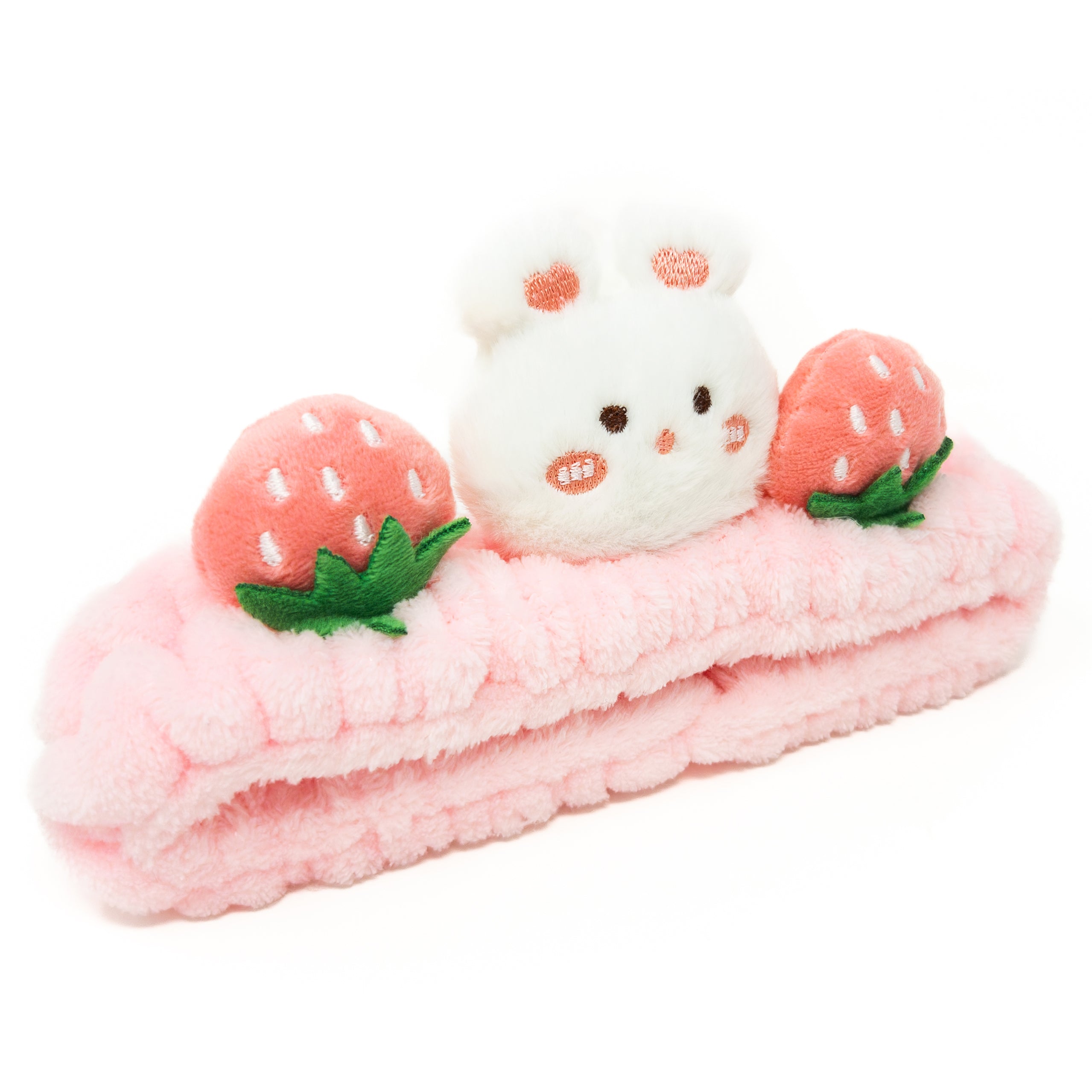 Pink plush headband with bunny and strawberries.