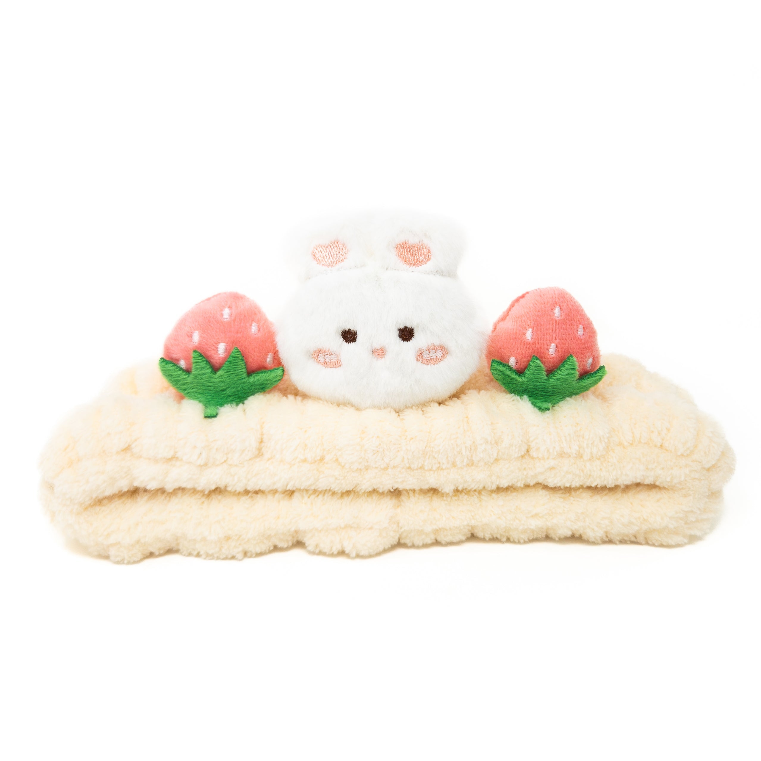 Plush headband with rabbit and strawberry details.
