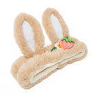 Tan bunny ear headband with strawberry and flower.