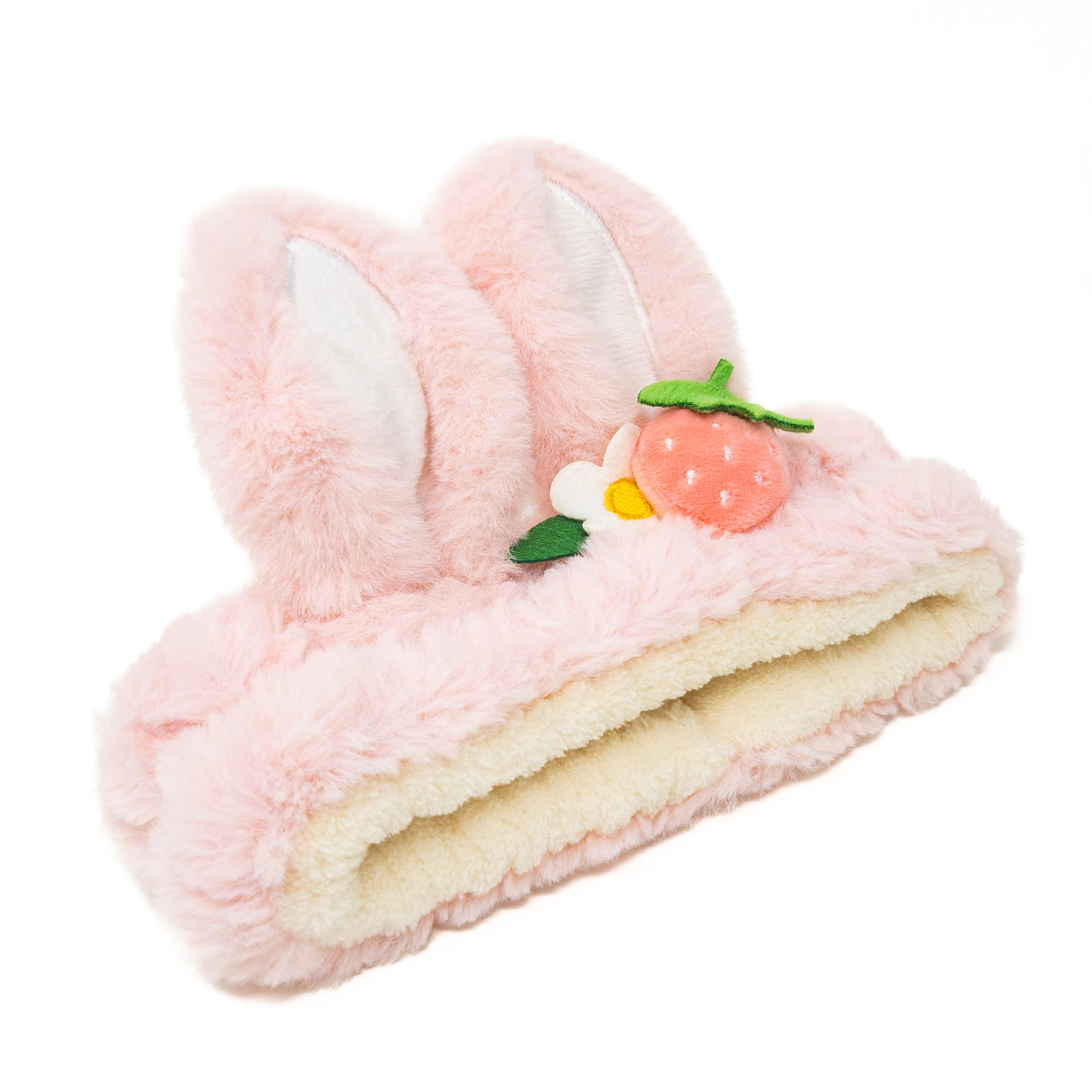 Pink, fluffy headband with bunny ears and a strawberry decoration.