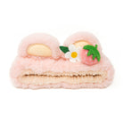 Pink fuzzy headband with bear ears, white flower, and strawberry.