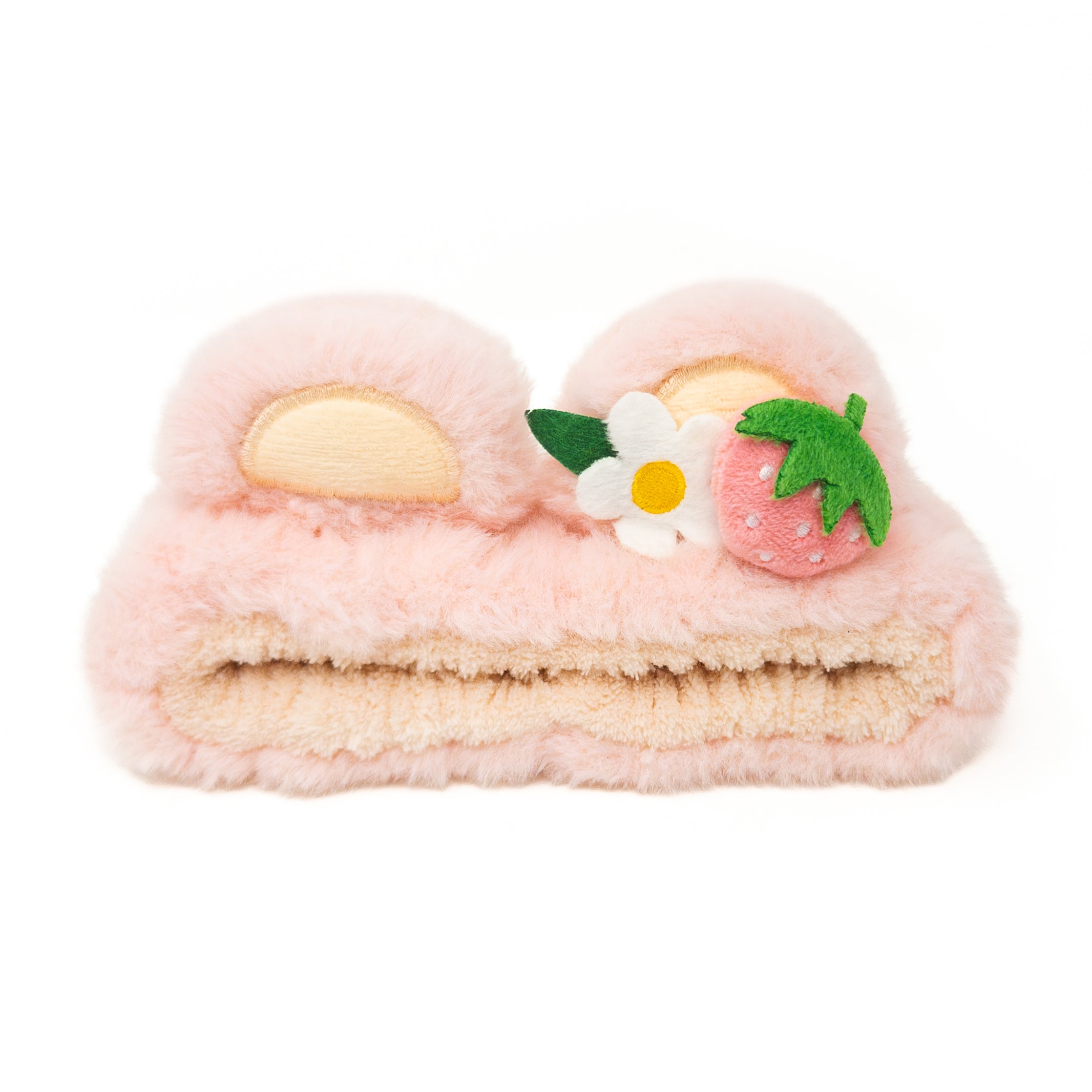 Pink fuzzy headband with bear ears, white flower, and strawberry.