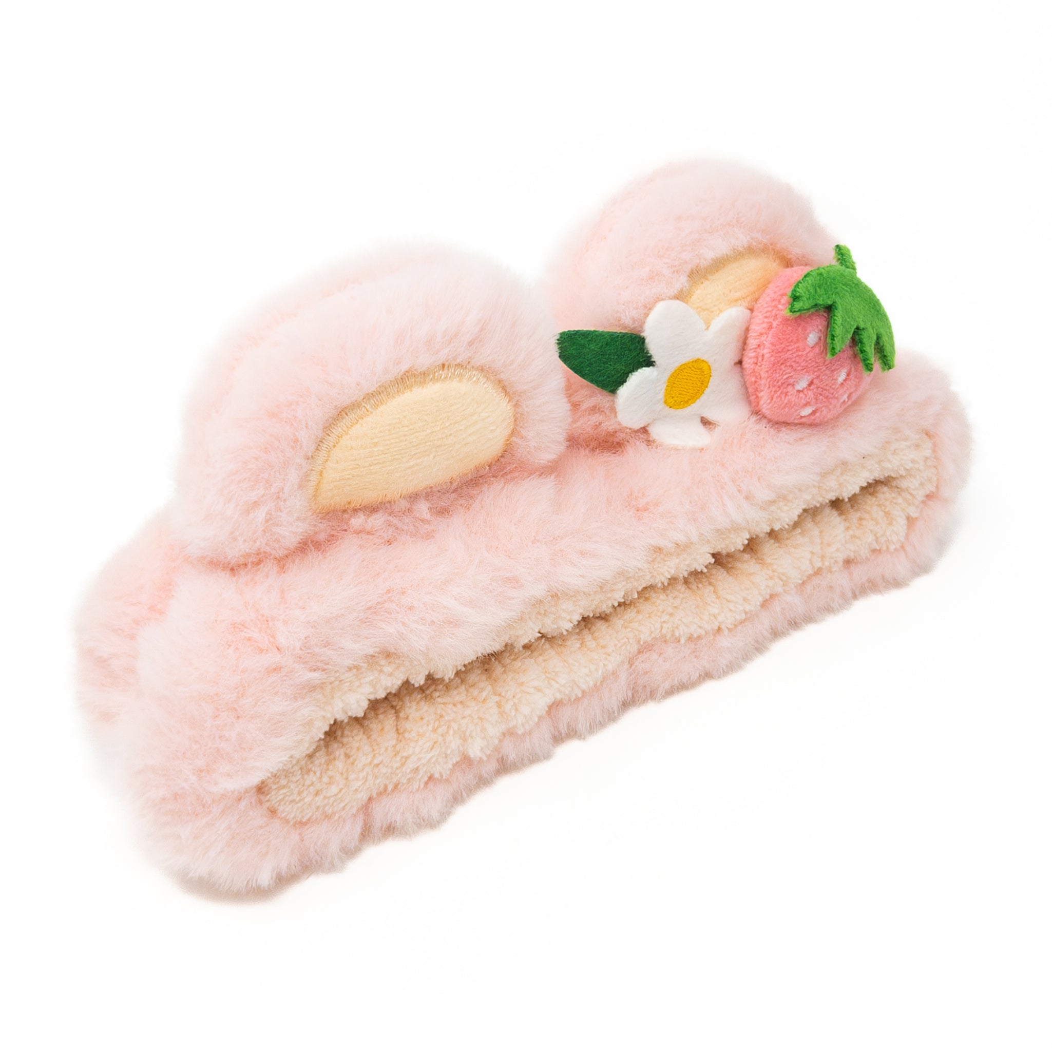 Pink fluffy headband with strawberry and flower detail.