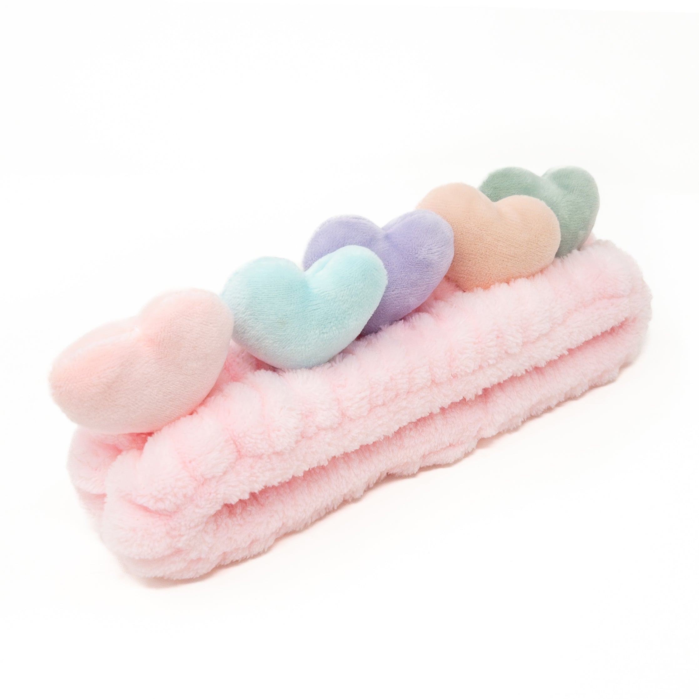Pink terrycloth headband with pastel hearts.