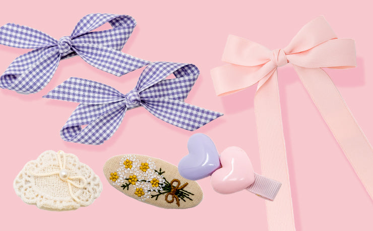 Puttisu hair accessories on a light pink background
