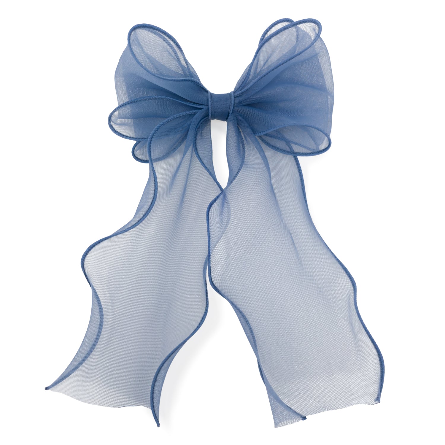 Blue organza large bow clip with sheer, flowing ribbons and wavy, wired edges, casting a soft shadow on white.