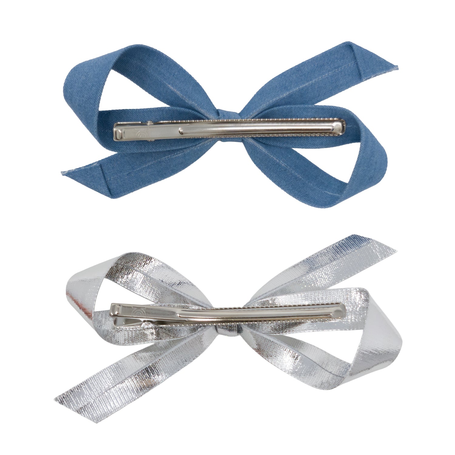 Two bow clips, one light denim and one silver, shown from the back with their metal clips.