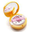 Open, yellow compact with mirror and applicator pad.