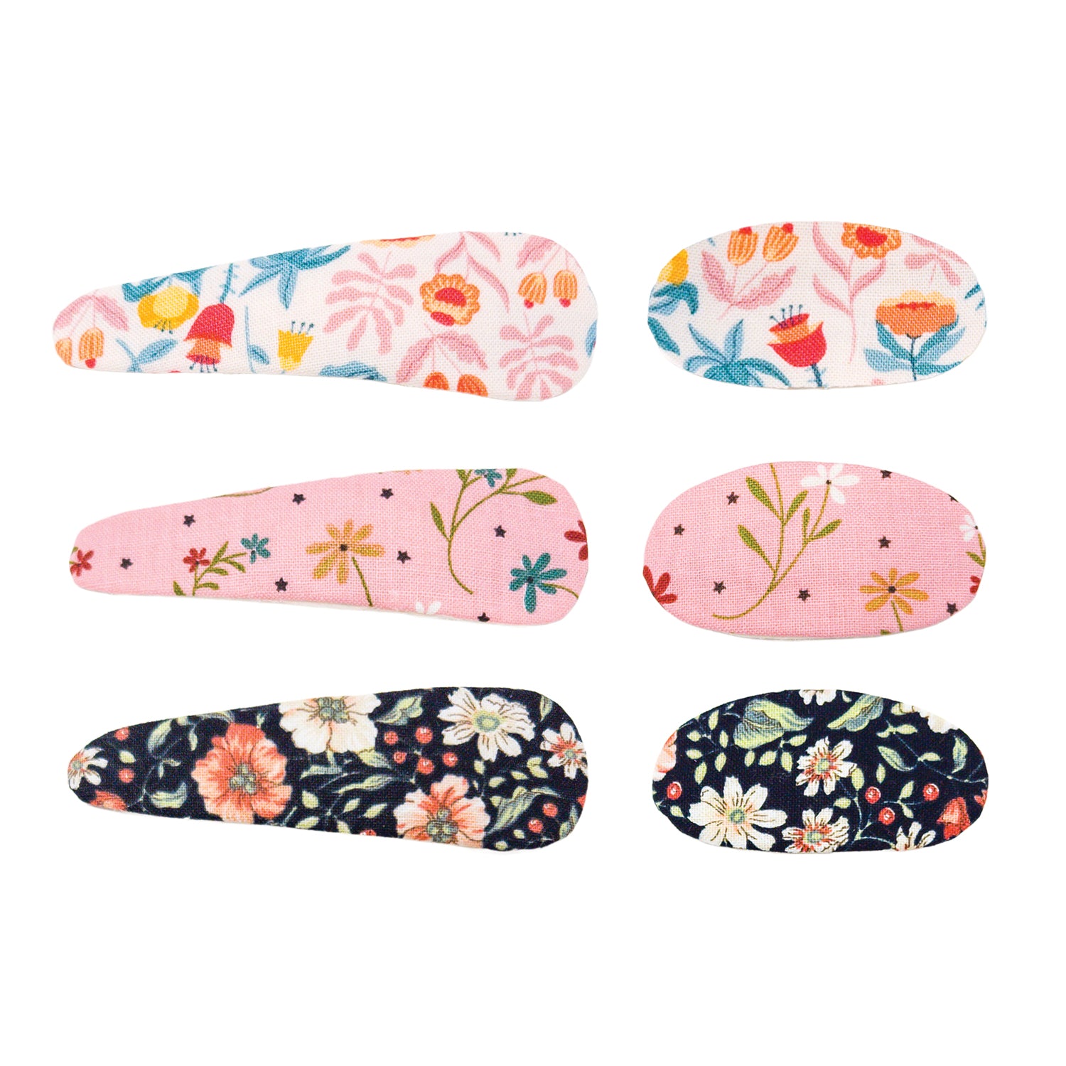 Floral hair clip set of 6 by Liberty, featuring three distinct colorful floral patterns on fabric in elongated and oval shapes.