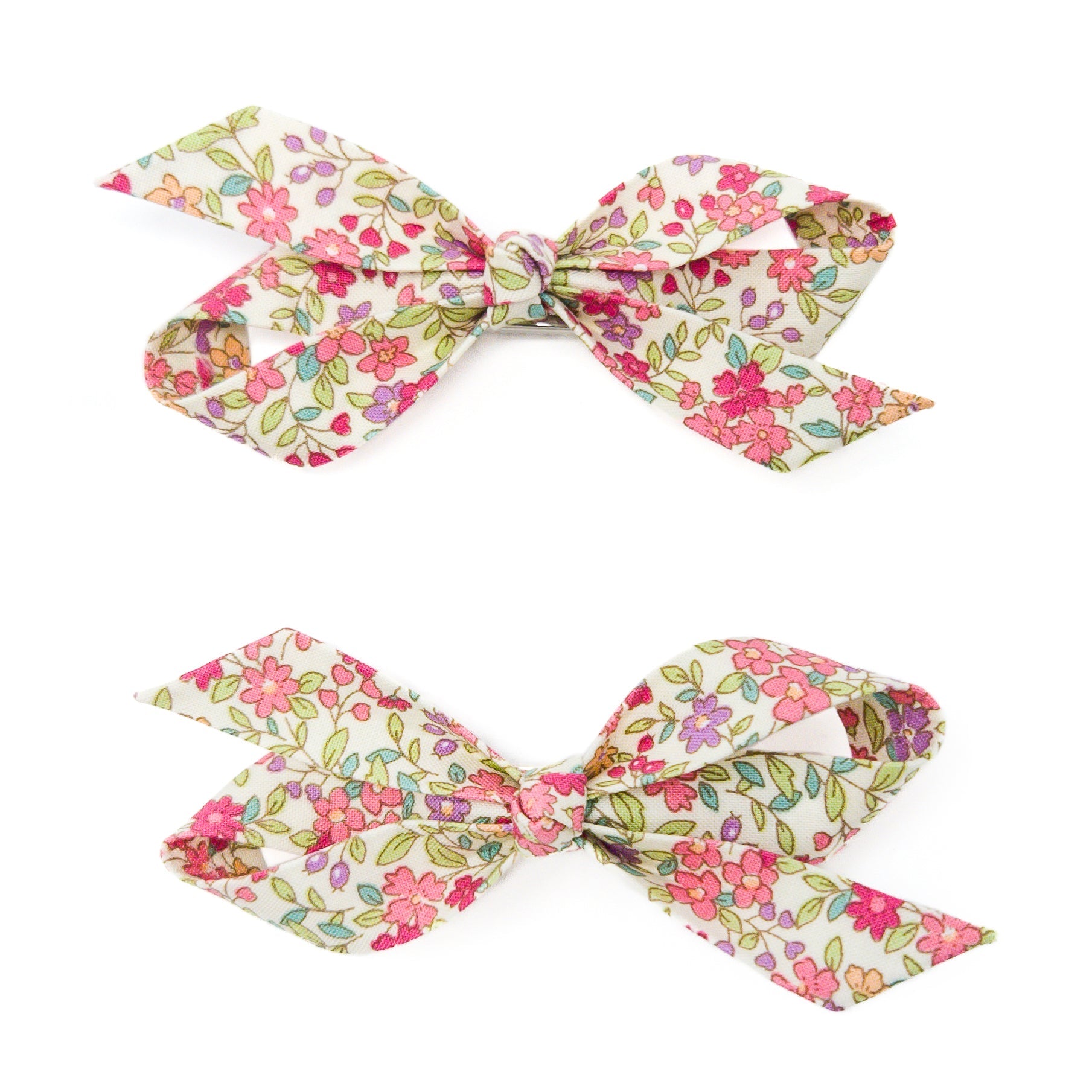 Two floral print hair bows.