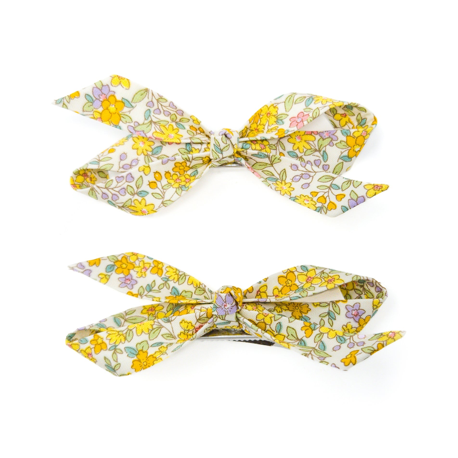 Two floral patterned hair clips.