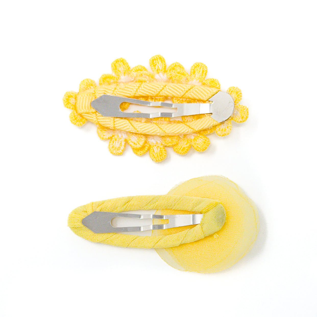 Two yellow flower hair clips.
