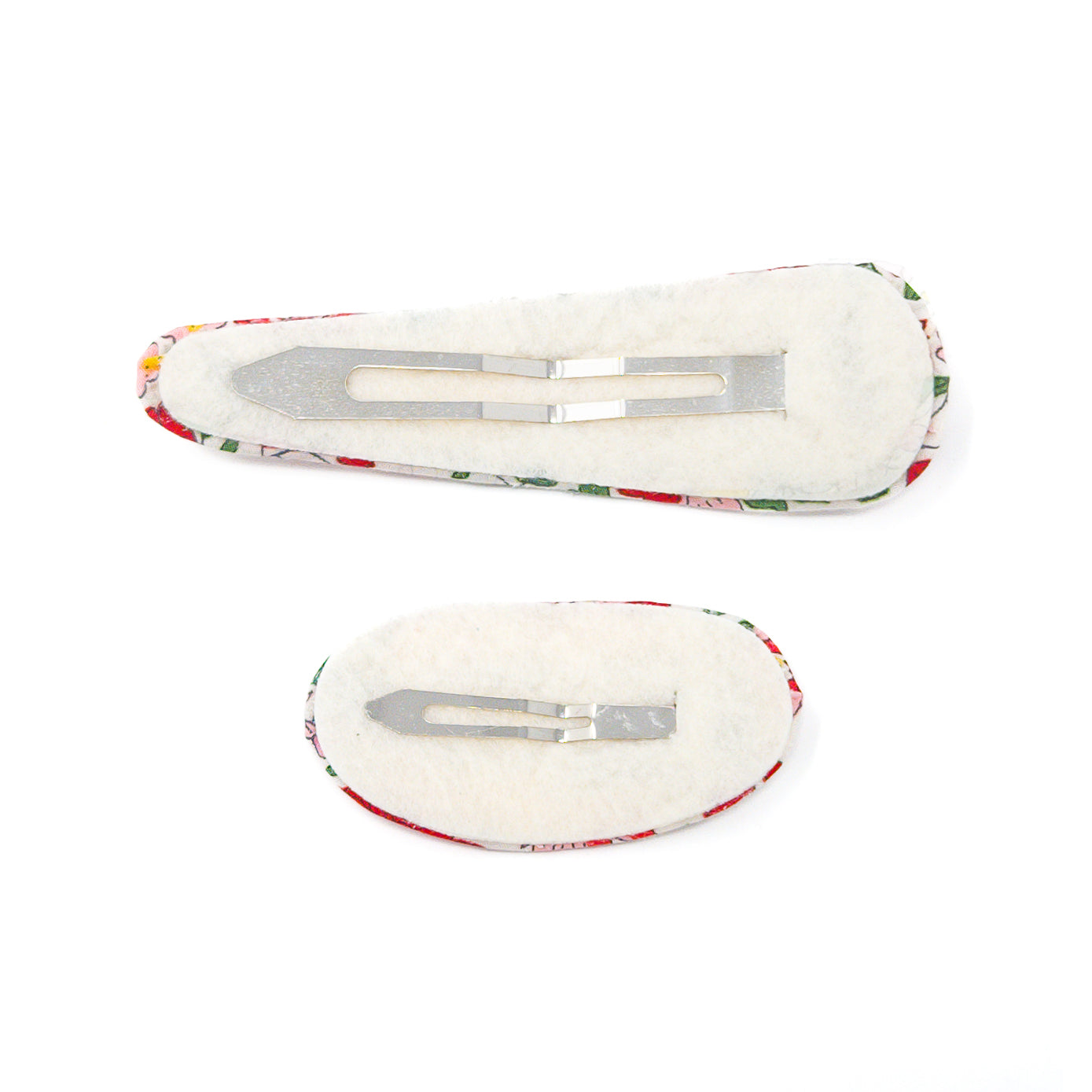 Two fabric-covered hair clips with metal fasteners.