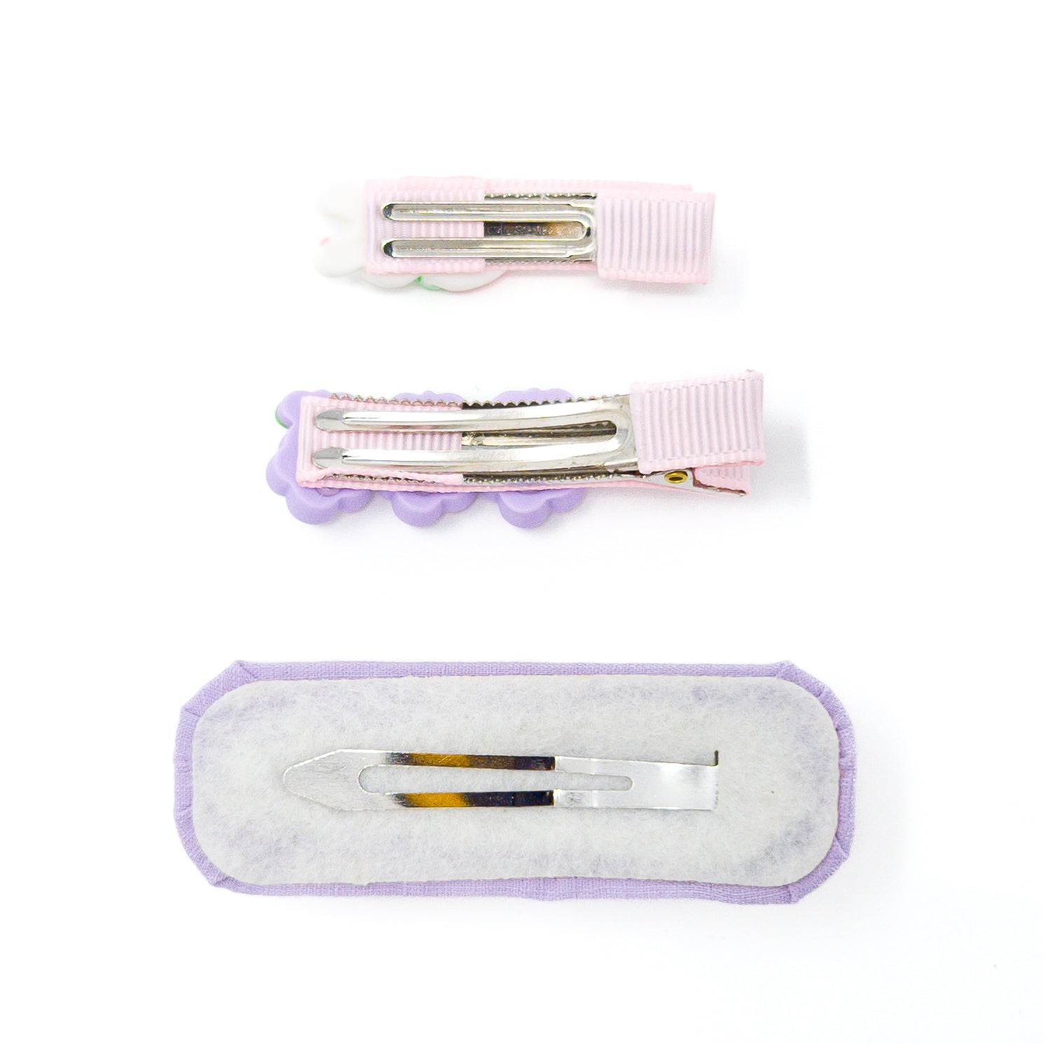 Three decorative hair clips.