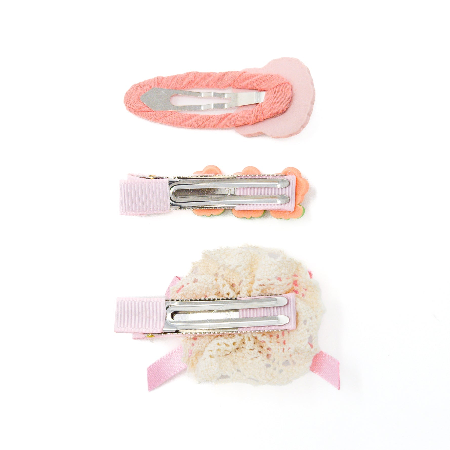Three hair clips with pink accents.