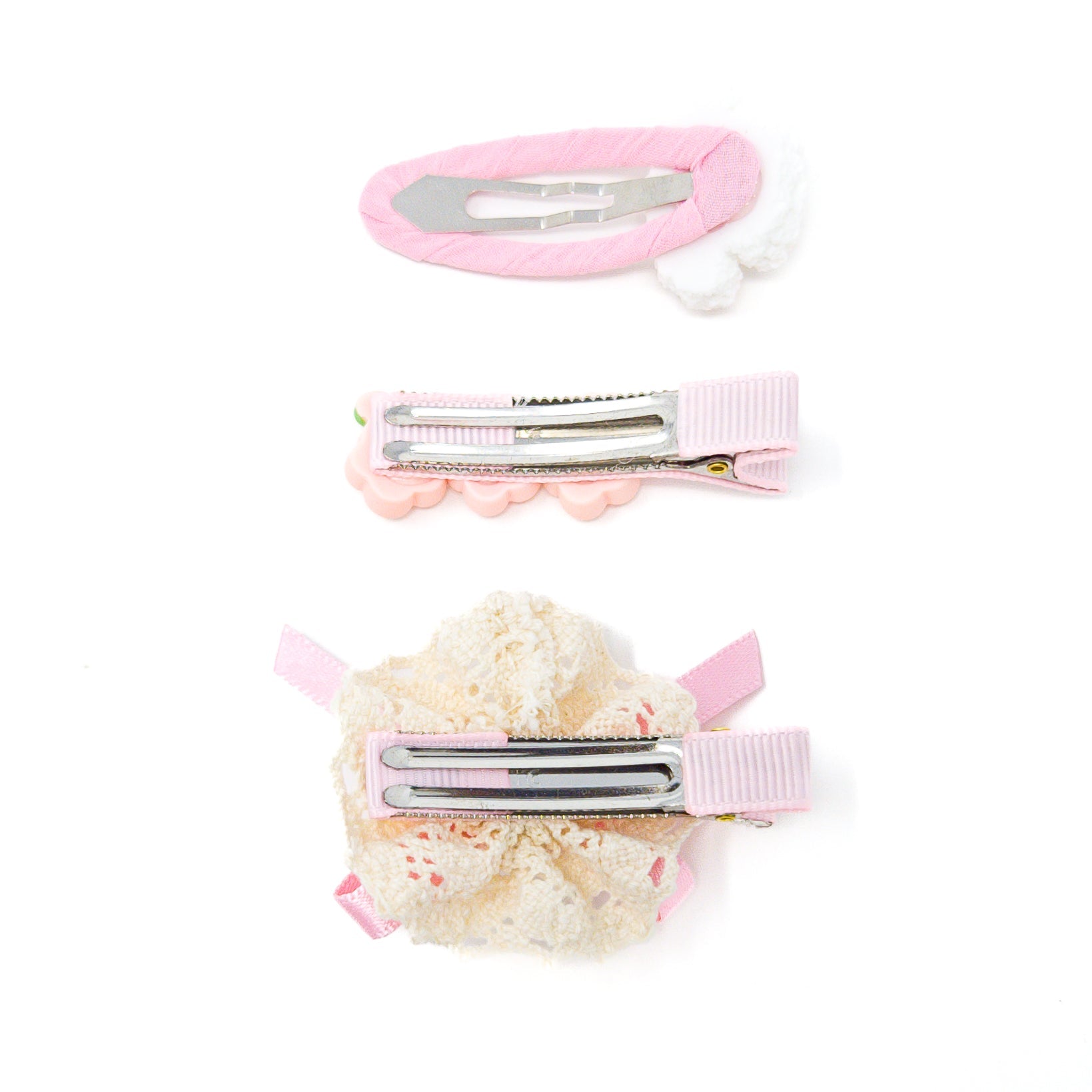 Three pink and white hair clips.