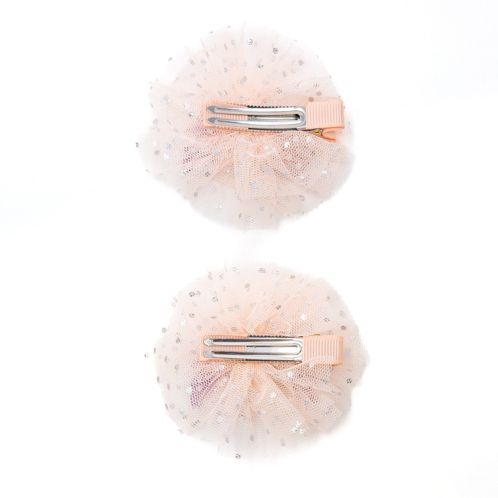 Two peach tulle hair clips with silver dots.
