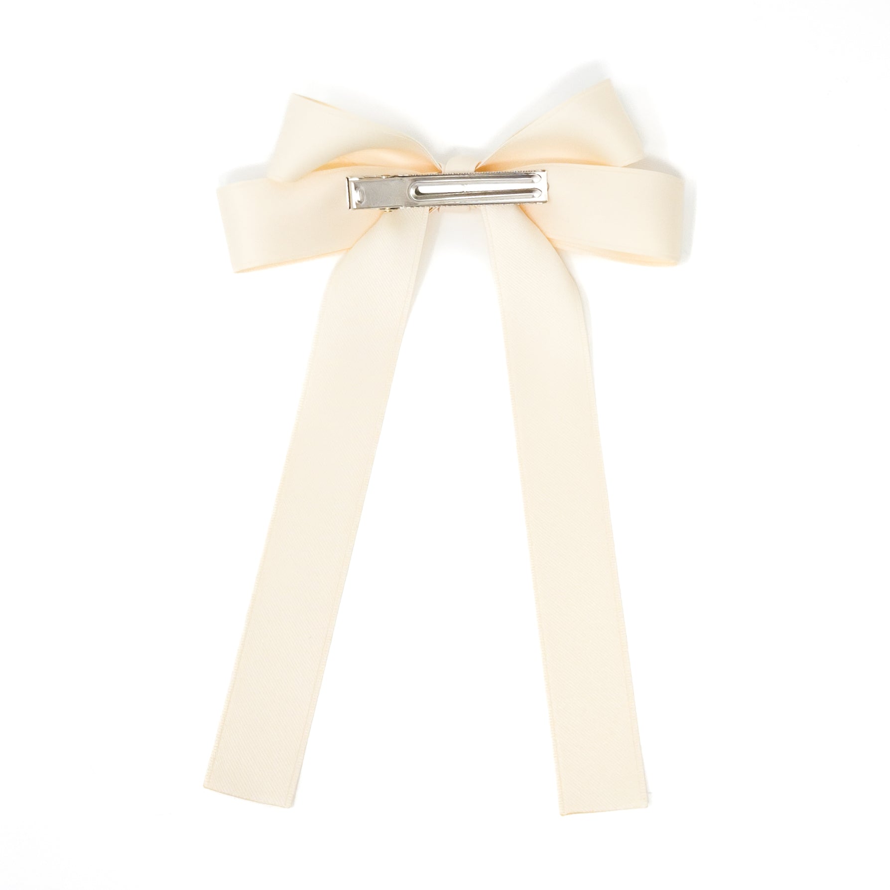 Off-white ribbon hair bow with silver clip.