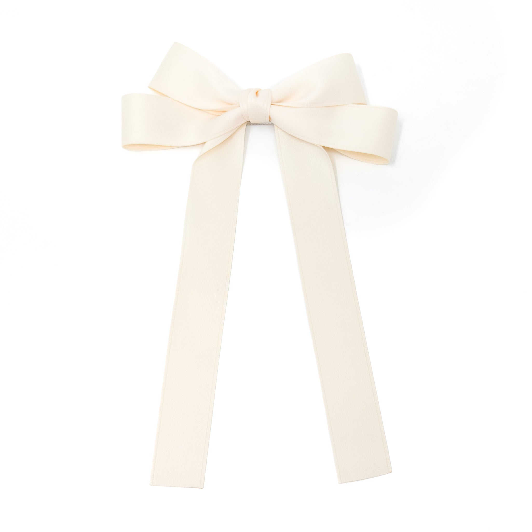 Ivory ribbon bow with long tails.
