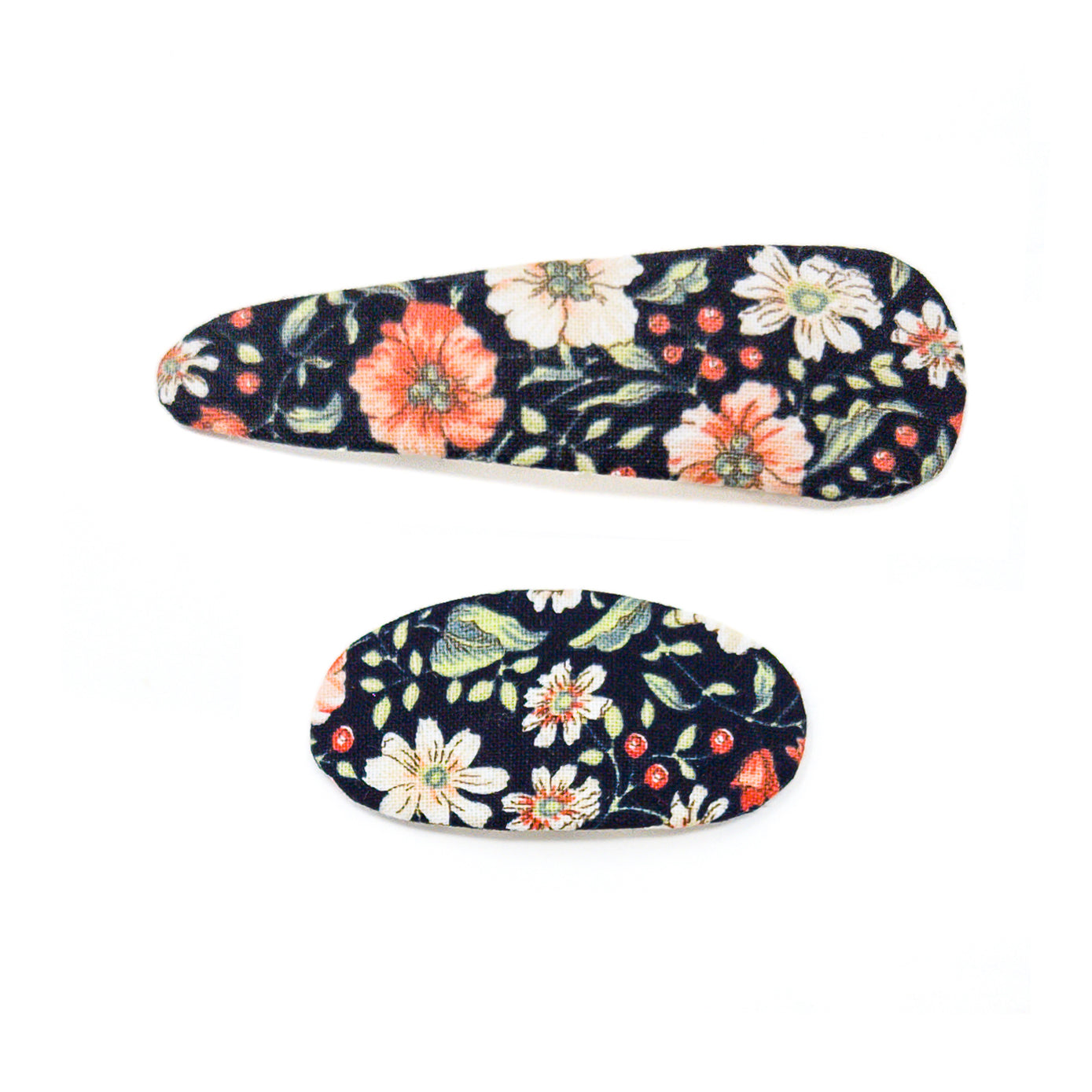Two floral fabric-covered hair clips on a white background.