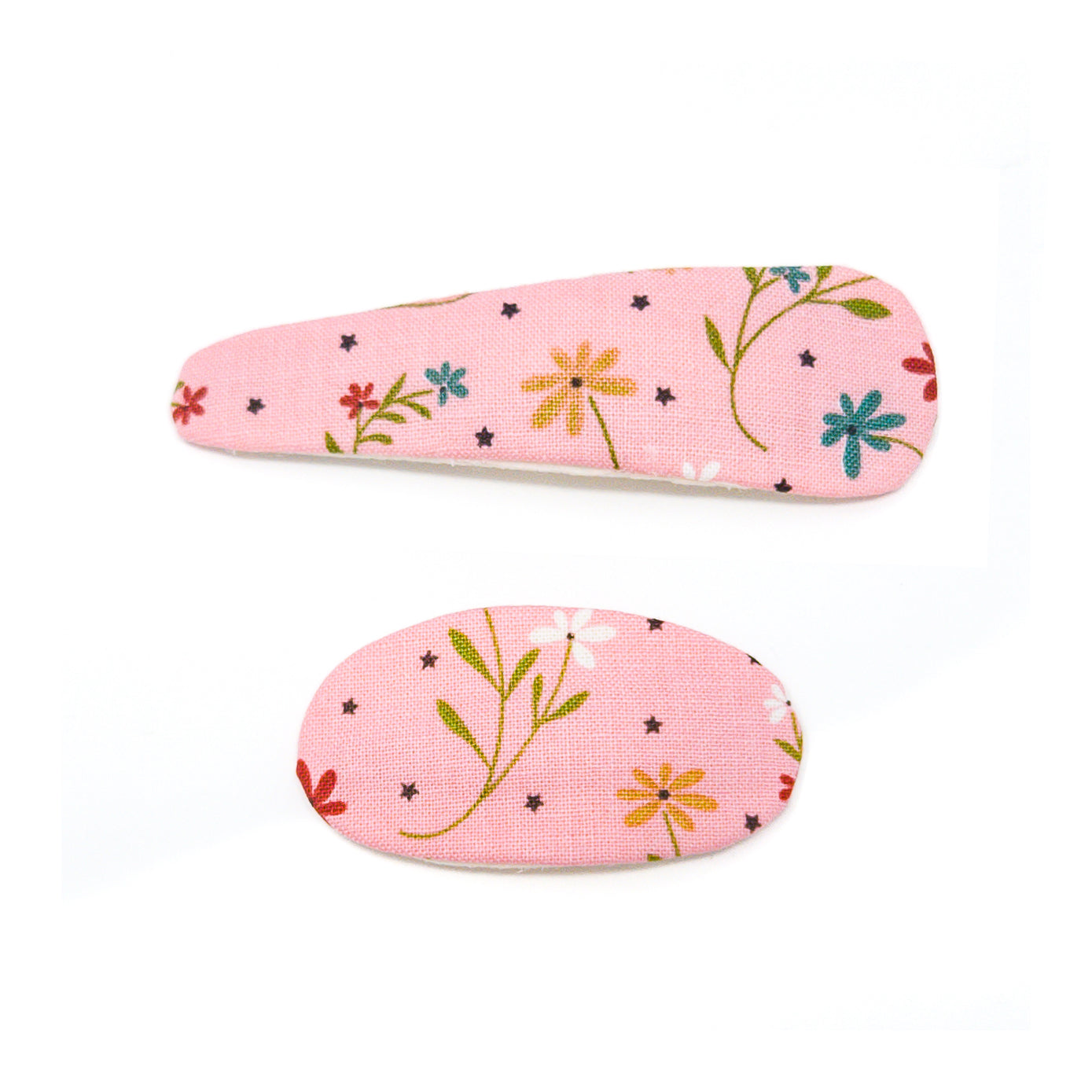 Two pink hair clips with a floral and star pattern.