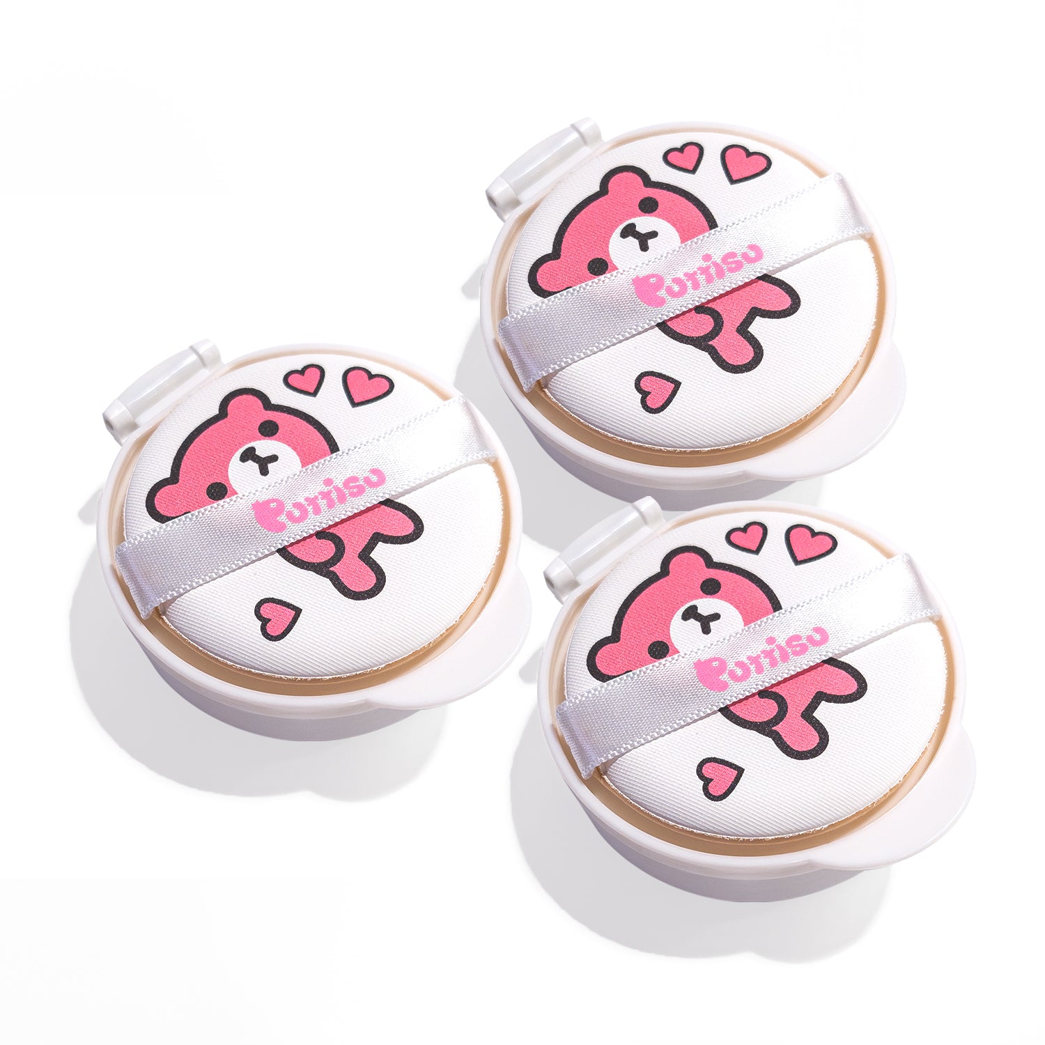 Three white and pink makeup sponges.