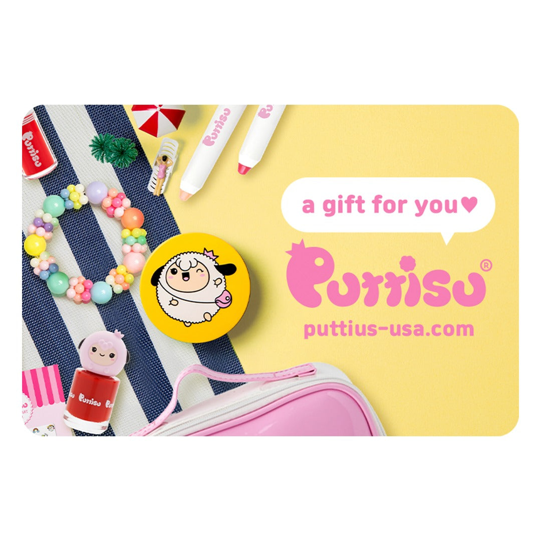 Close-up of a colorful scene: a bracelet, a yellow button with a cartoon sheep, red nail polish, and a pink cosmetic bag are arranged on a blue and white striped surface next to a yellow background with a text bubble reading "a gift for you" and the "Puttisu" logo and website address.
