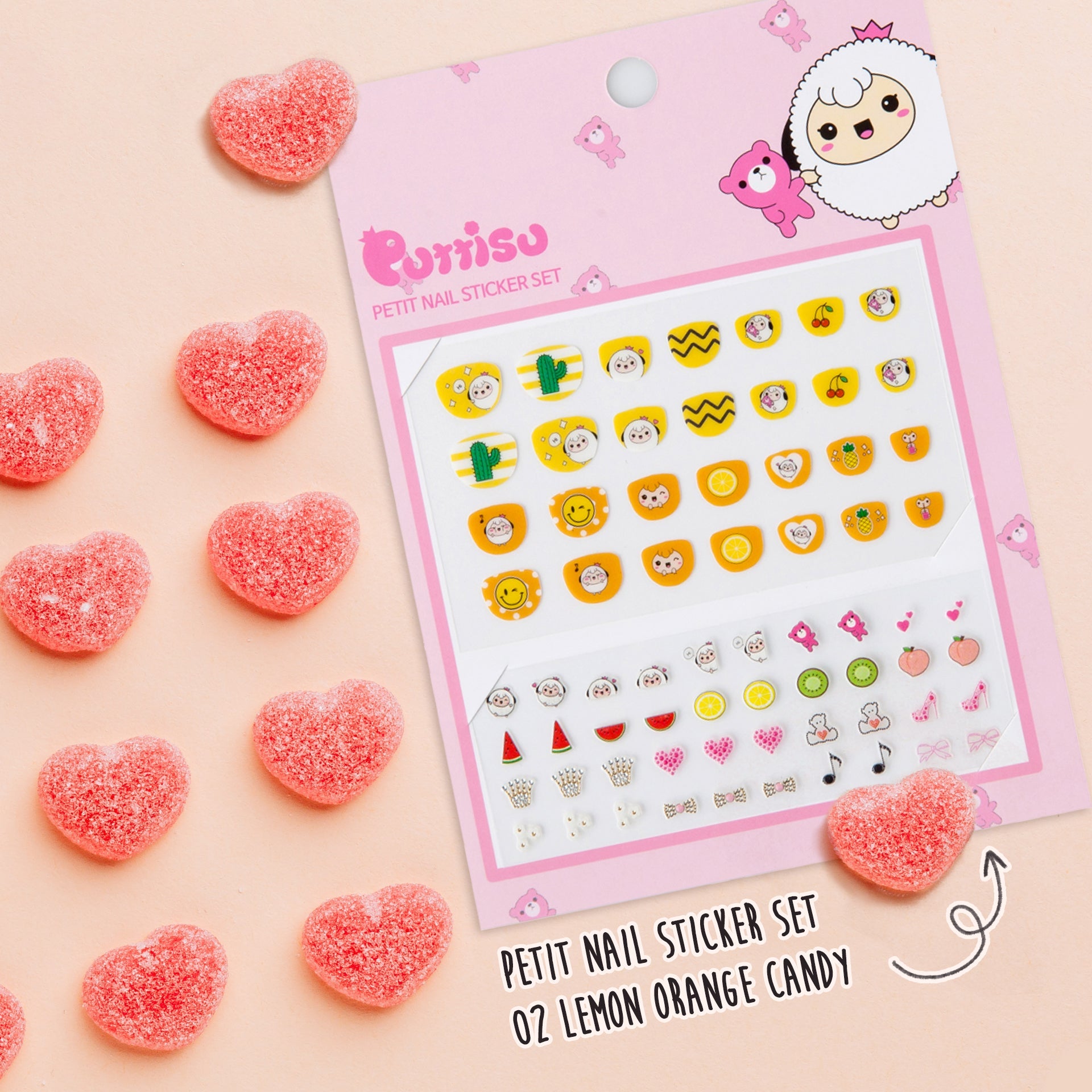 A package of nail stickers on a peachy background, with heart-shaped candies scattered around.