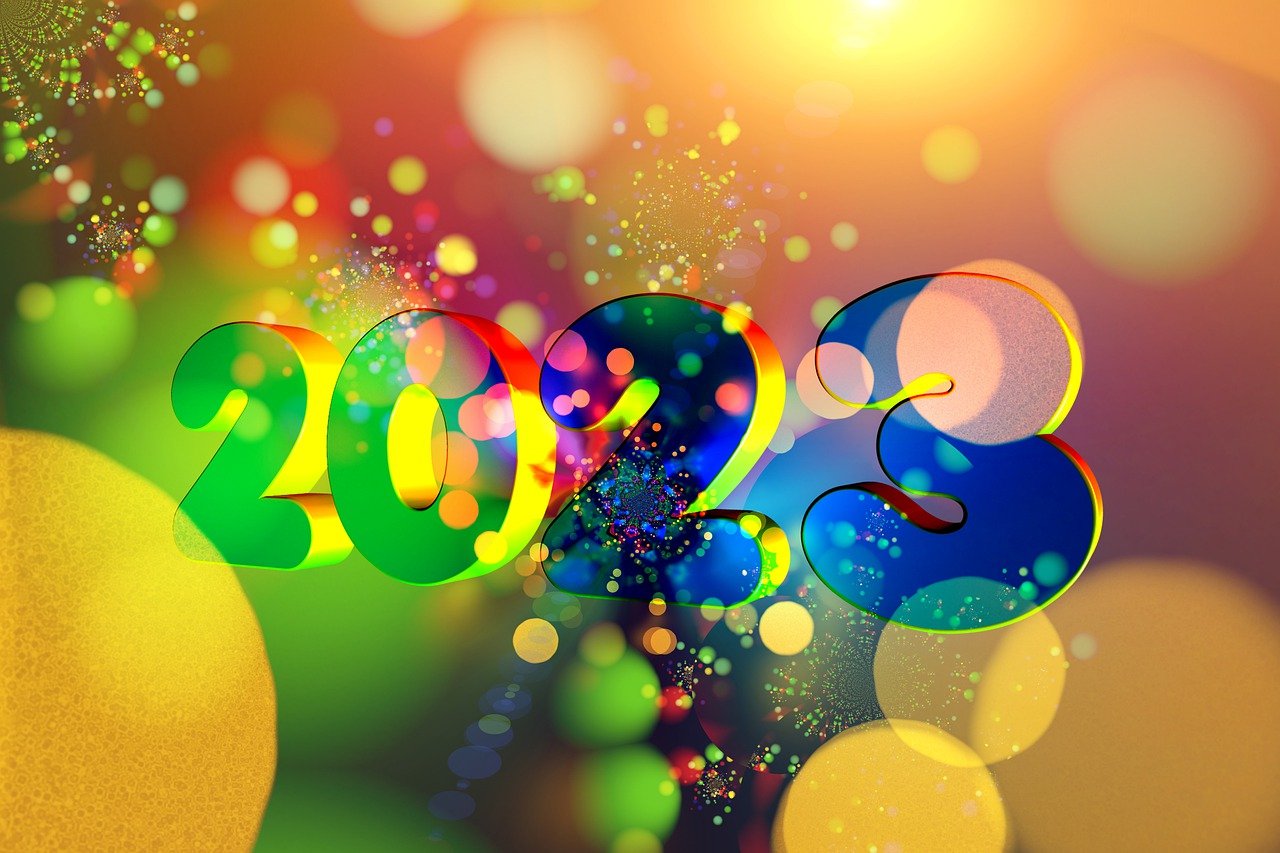 Vibrant 2023 New Year design with colorful lights and festive celebration background.