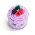 Lavender soy wax candle by Opalhouse, with berry accents and green leaf, in a clear glass jelly cup.