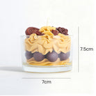 Jellycup dessert candle by Candleaf, with chocolate embellishments and tan colored wax in a clear glass.