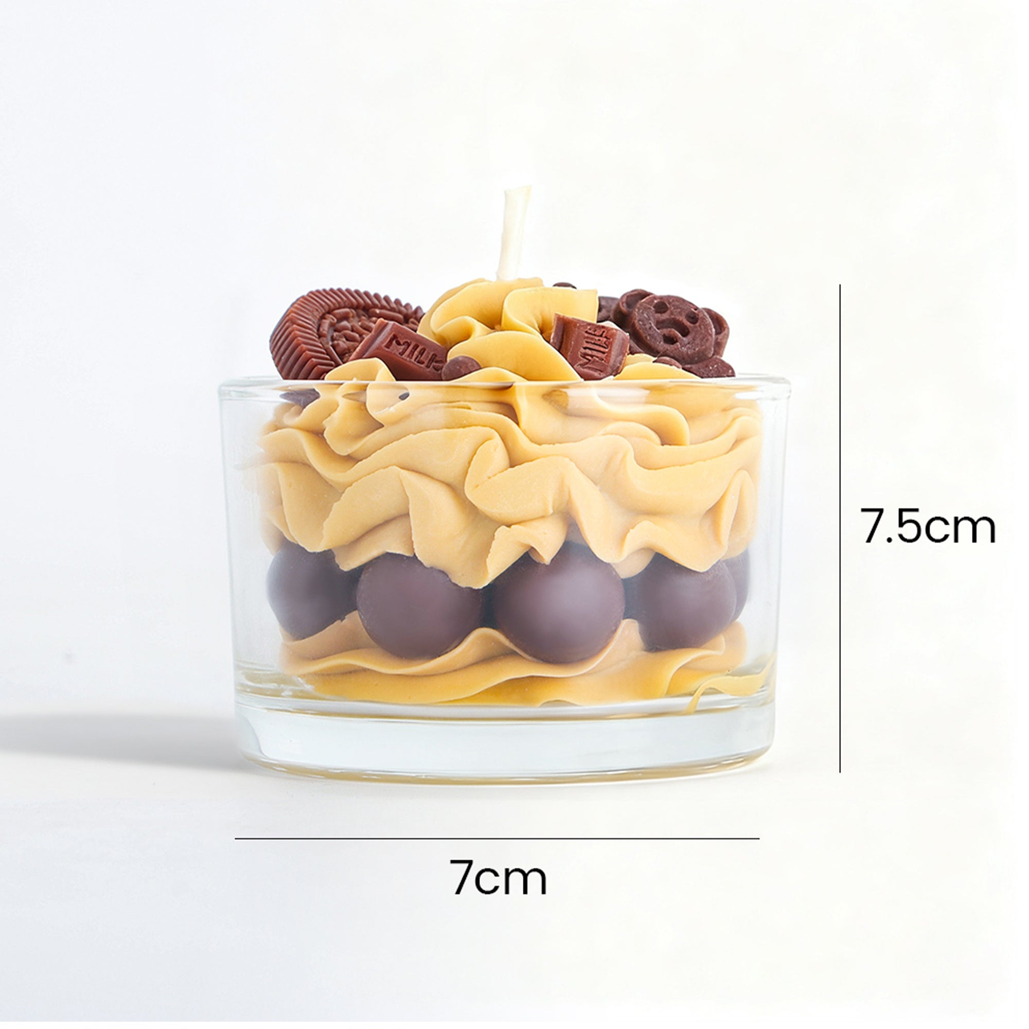 Jellycup dessert candle by Candleaf, with chocolate embellishments and tan colored wax in a clear glass.