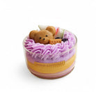 Jellycup cake soy wax candle with teddy bear detail, inside a glass container with purple frosting.
