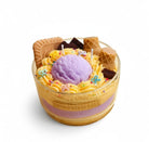 Novelty cake soy wax candle with ice cream scoop accent, handmade scented candle with sprinkles and waffle cone pieces.