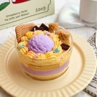 Jellycup cake soy wax candle with cookie and waffle cone accents, topped with sprinkles.
