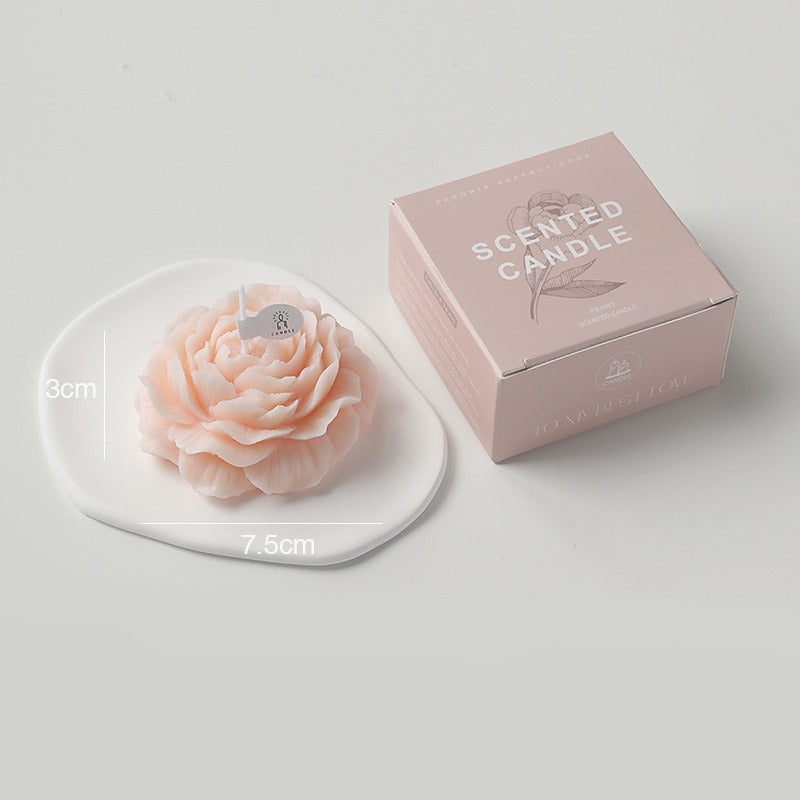 Peonie flower scented soy wax candle by Jellycup with a square pink box on a white background.