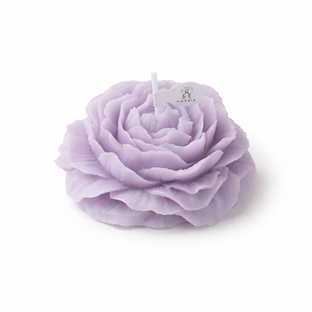 Lavender peonie flower soy wax candle by Jellycup, adorned with a white flag label and detailed petal texture.
