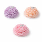 Pastel flower shaped Jellycup Peonie soy wax candles from Japan, with small white paper flags.